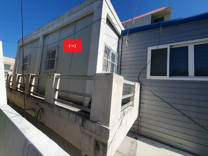 제시외 건물 기호[ㄱ): 판넬조 판넬지붕 2층 소재 사무실]
