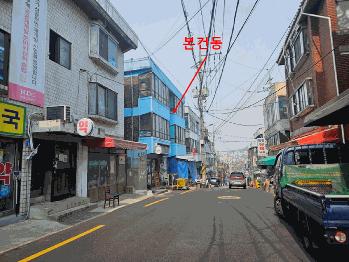 [본건 북동측 도로변 주위환경2]