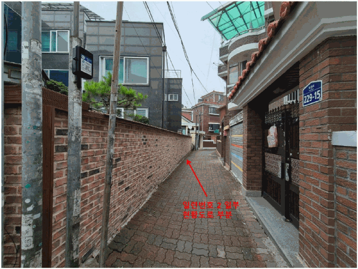 남동측 접면도로(일련번호2 일부 현황도로) 및 주위환경