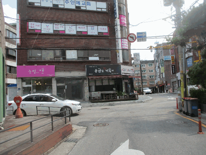 1층 및 제시외건물(ㄱ)